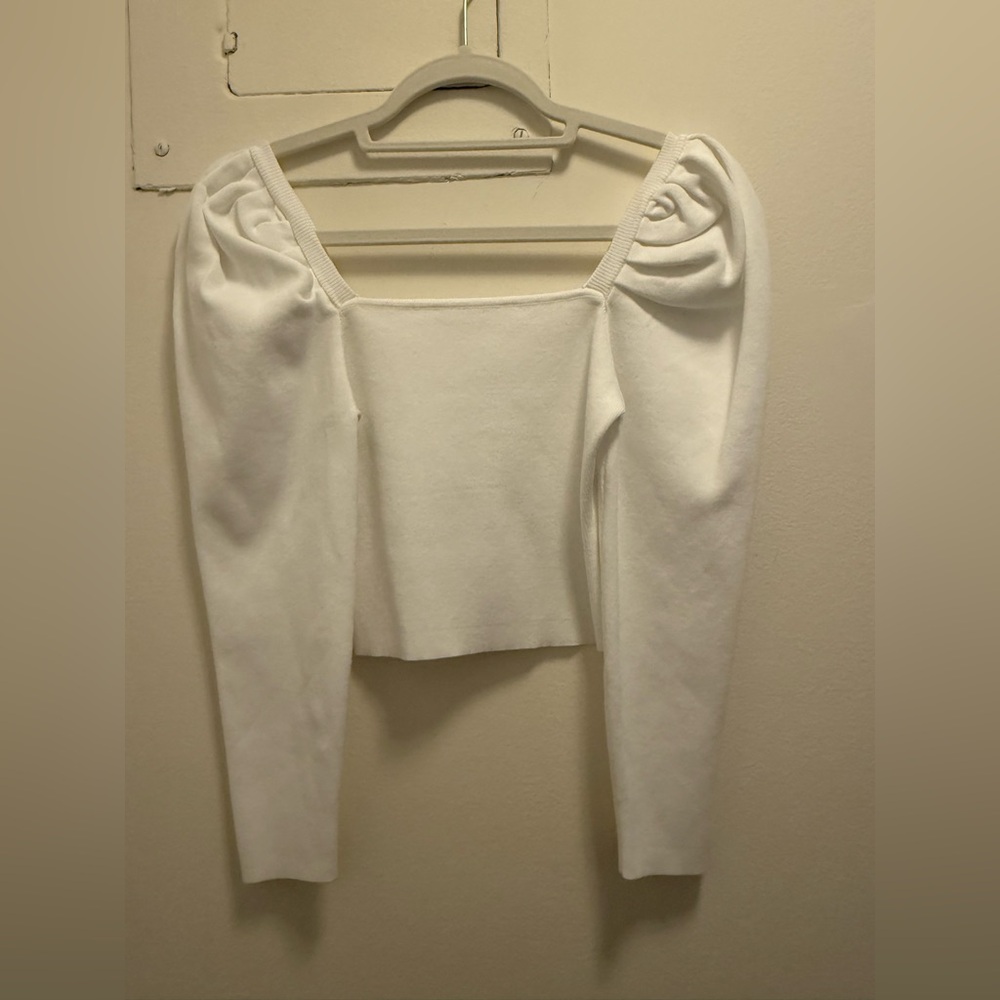 White crop top with puff sleeve.